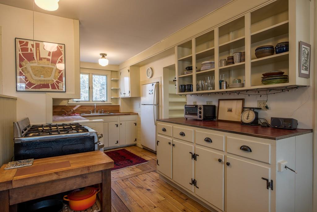178 West Farms Road Northampton, MA 01062 - Photo 20 of 42 a kitchen with stainless steel appliances a stove and white cabinets