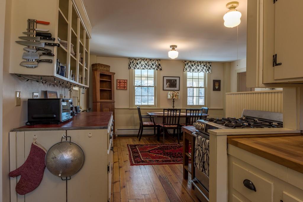 178 West Farms Road Northampton, MA 01062 - Photo 21 of 42 a kitchen with stainless steel appliances granite countertop a stove a sink and a microwave