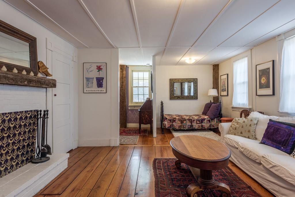 178 West Farms Road Northampton, MA 01062 - Photo 27 of 42 a living room with furniture a window and a fireplace