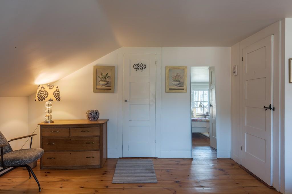 178 West Farms Road Northampton, MA 01062 - Photo 32 of 42 a view of a hallway with wooden floor and a cabinet