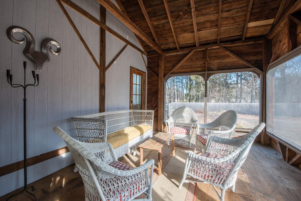 178 West Farms Road Northampton, MA 01062 - Photo 40 of 42 a dining room with furniture a chandelier and wooden floor