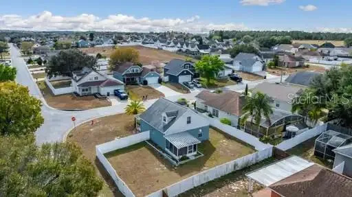 an aerial view of a house with a ocean view