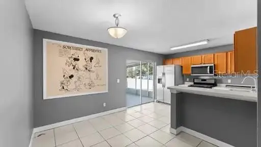 a kitchen with stainless steel appliances a stove refrigerator sink and cabinets