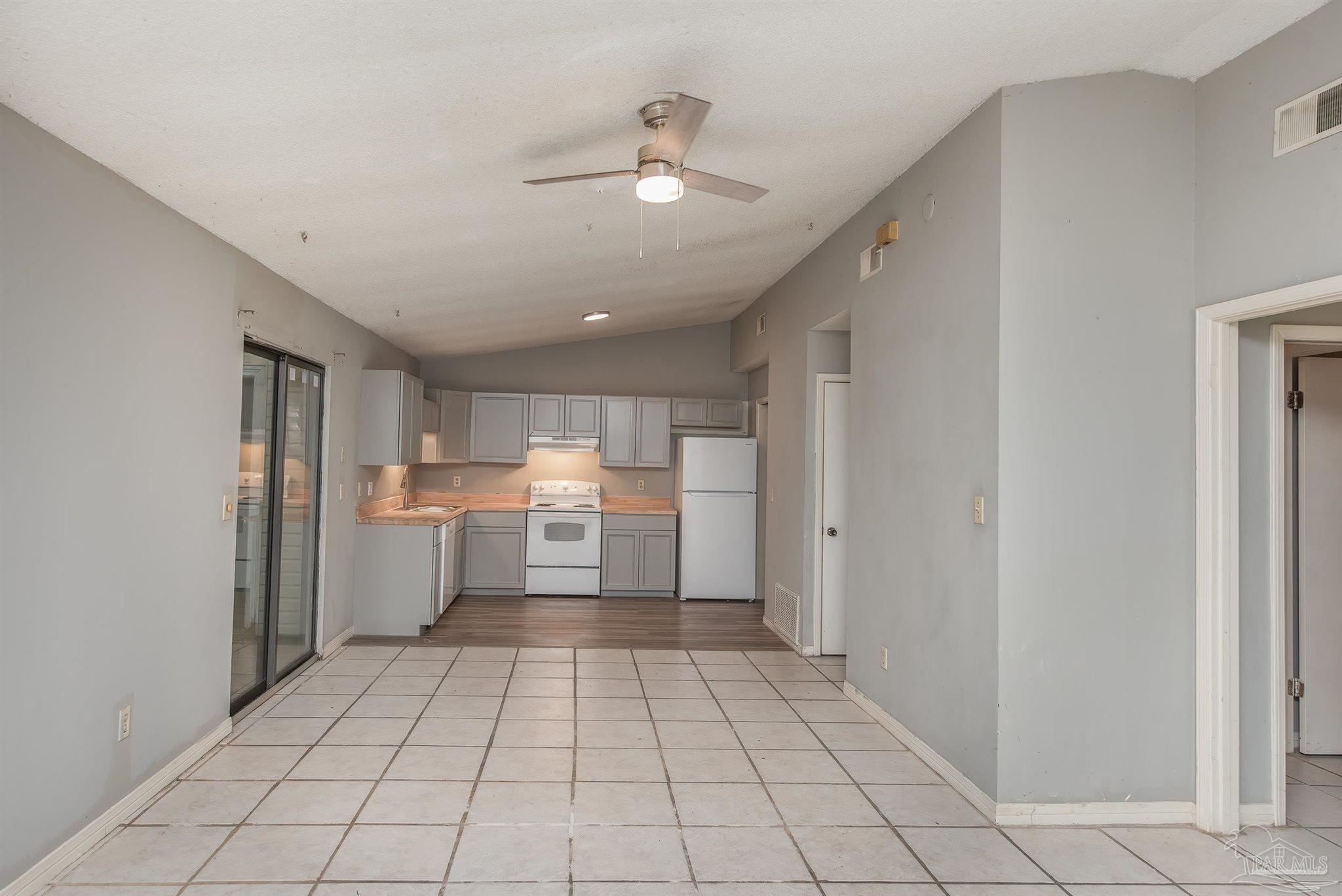8210 Kipling Street, Unit A Pensacola, FL 32514 - Photo 2 of 13 a view of a kitchen with a sink and dishwasher cabinets