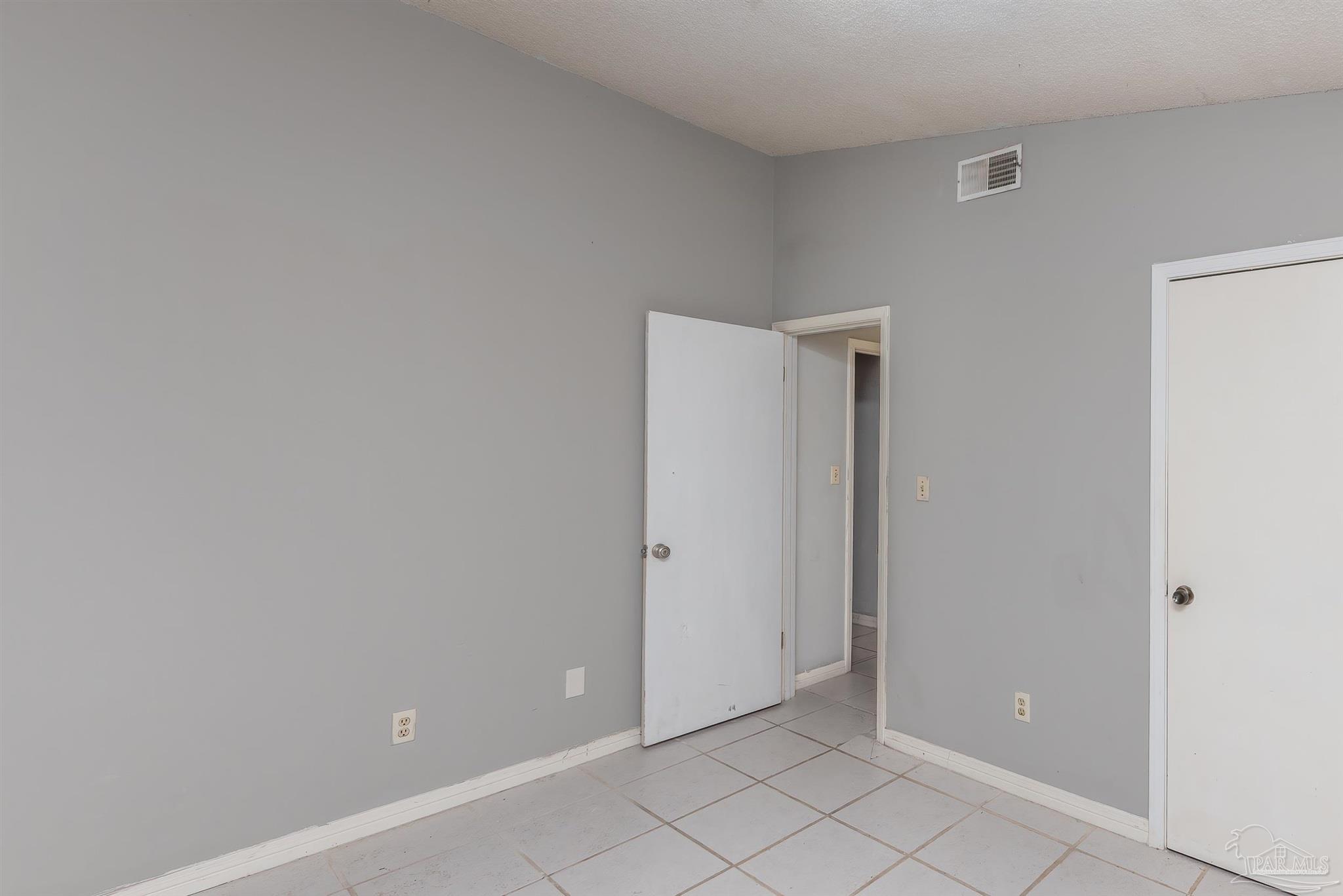 8210 Kipling Street, Unit A Pensacola, FL 32514 - Photo 9 of 13 a view of an empty room