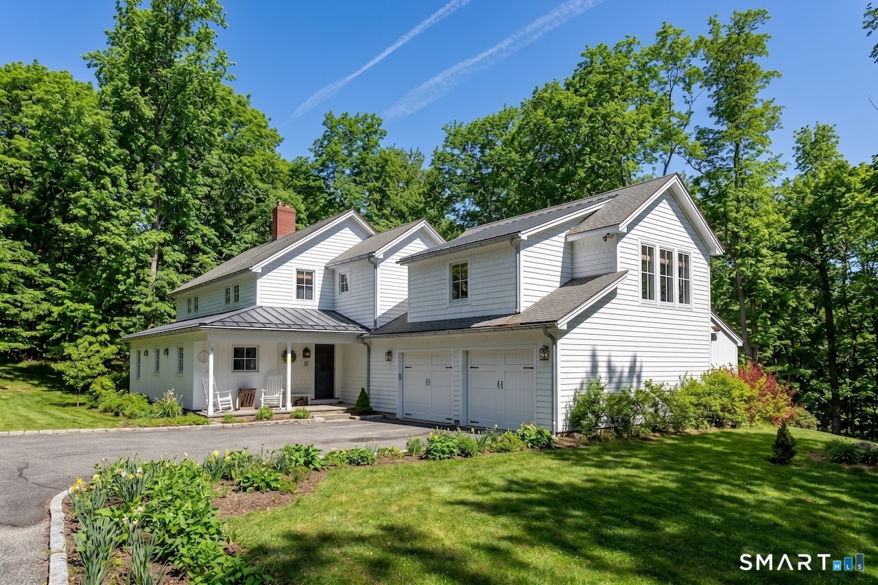 9 Old Paddock Lane Kent, CT 06785 - Photo 2 of 28 a front view of a house with a garden