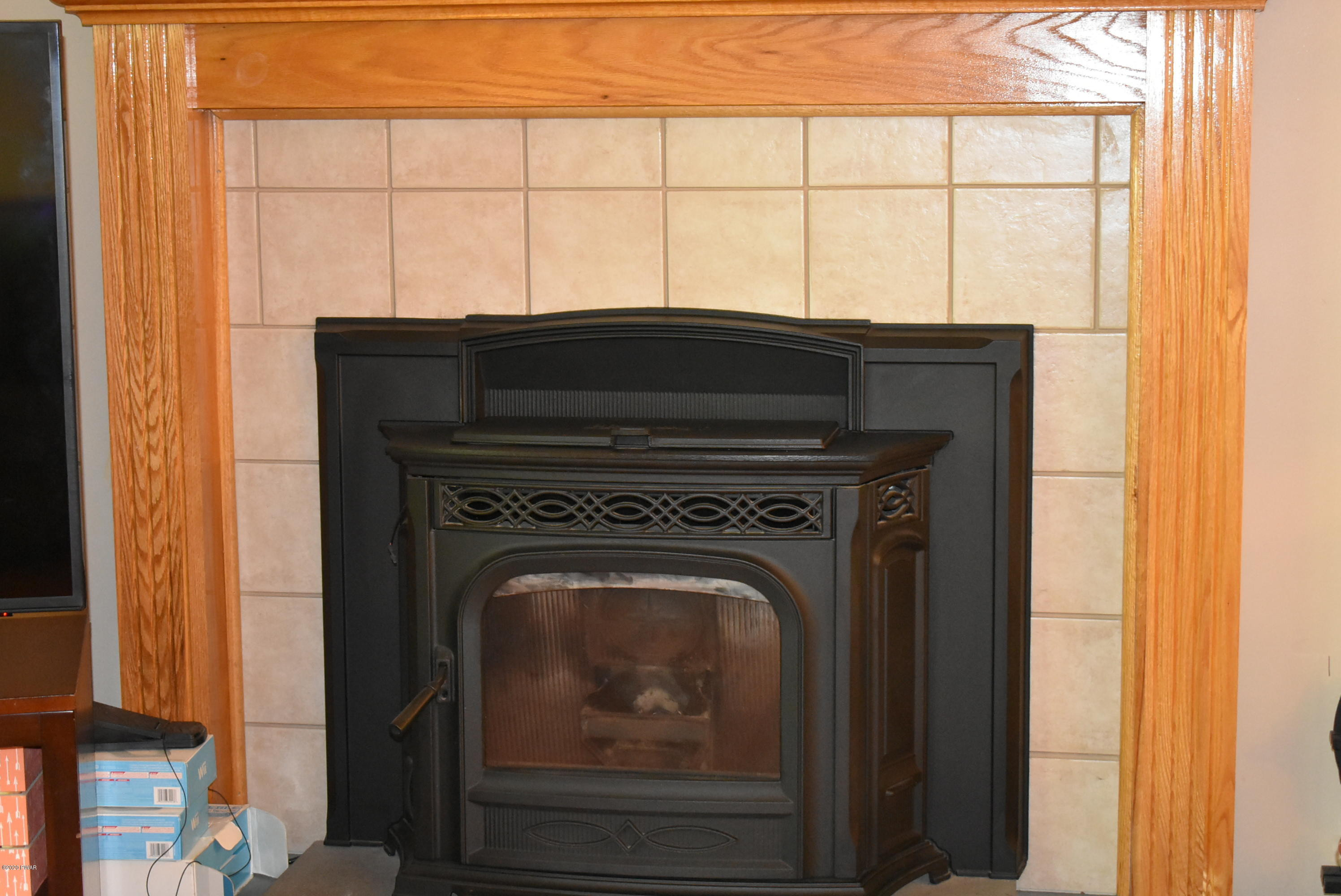 119 Gapview Road Milford, PA 18337 - Photo 3 of 16 Tile fireplace with Pellet stove insert
