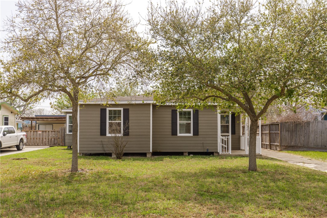 3513 Monterrey Street Corpus Christi, TX 78411 - Photo 2 of 34 front view of a house with a yard