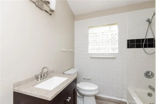 a bathroom with a shower and a window