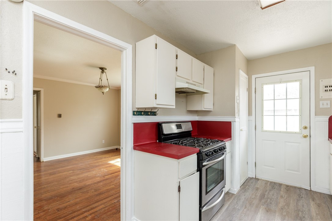 3513 Monterrey Street Corpus Christi, TX 78411 - Photo 27 of 34 a kitchen with stainless steel appliances a stove a sink and a refrigerator