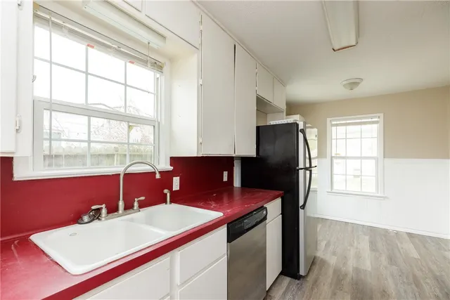 a kitchen with stainless steel appliances granite countertop a stove and a refrigerator