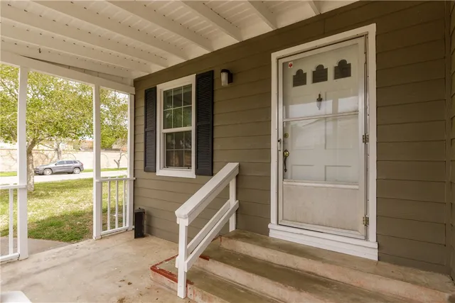 a front view of a house with a porch