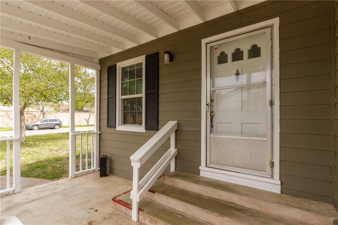 3513 Monterrey Street Corpus Christi, TX 78411 - Photo 3 of 34 a front view of a house with a porch