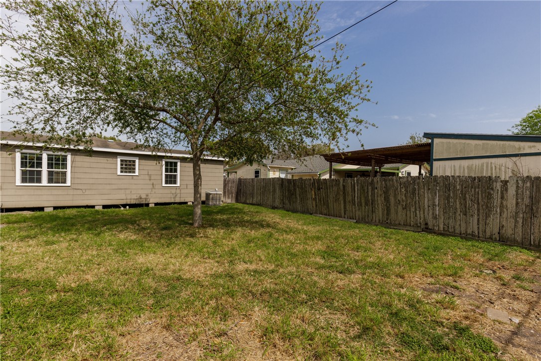 3513 Monterrey Street Corpus Christi, TX 78411 - Photo 33 of 34 a backyard of a house with lots of green space