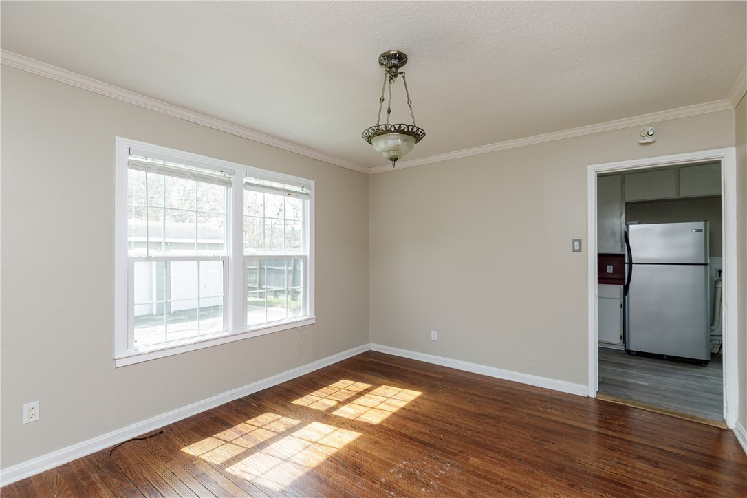 3513 Monterrey Street Corpus Christi, TX 78411 - Photo 10 of 34 a view of empty room with wooden floor and fan