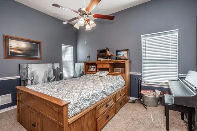 a bed room with a bed and a chandelier