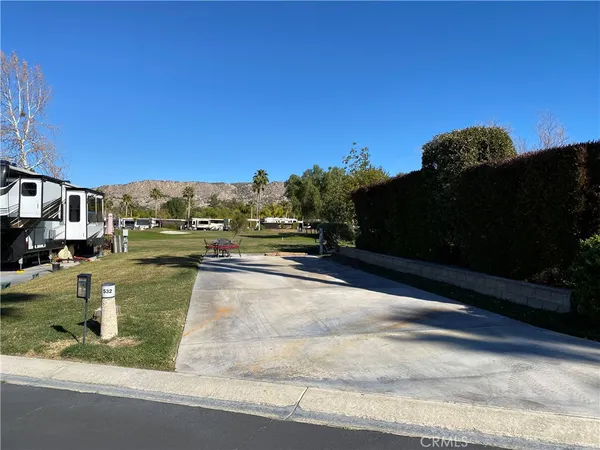 a view of a street with houses on both side of the street
