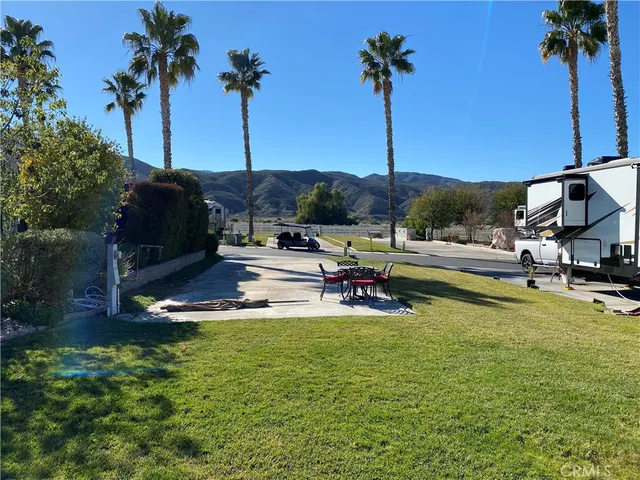 a view of a swimming pool with a table and chairs