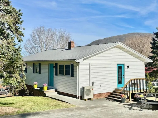 a front view of a house with a garage