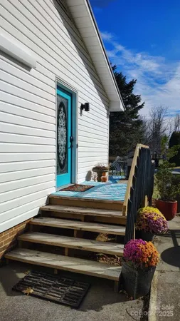 a view of backyard with seating space and plants