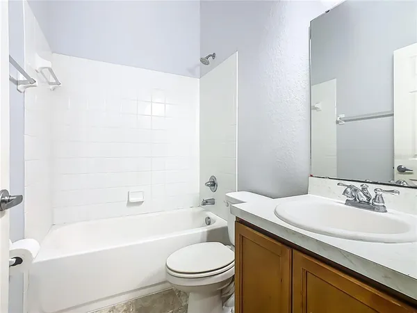 a bathroom with a sink a toilet and a bathtub