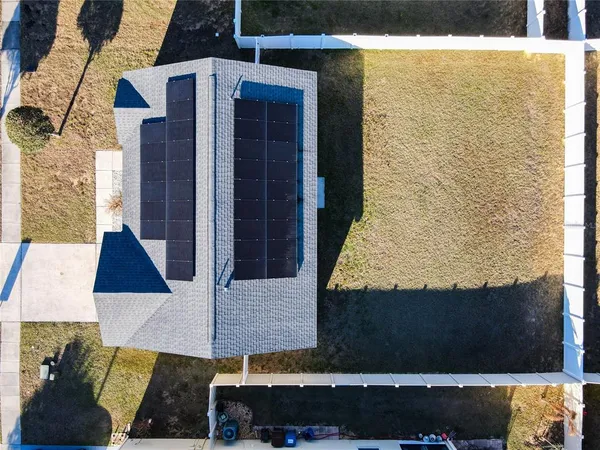 an aerial view of residential houses with city view