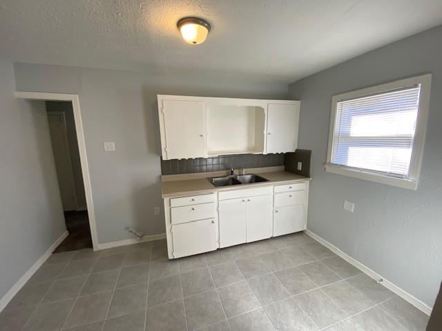 200 South Roberts Cut Off Road Fort Worth, TX 76114 - Photo 5 of 13 a utility room with cabinets washer and dryer