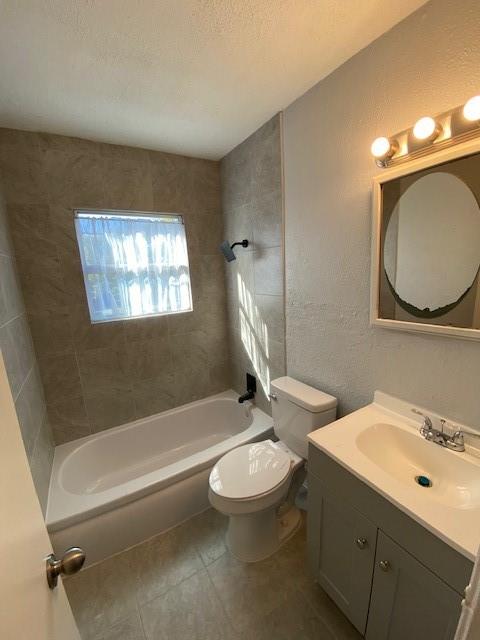 200 South Roberts Cut Off Road Fort Worth, TX 76114 - Photo 8 of 13 a bathroom with a toilet a sink a tub and mirror