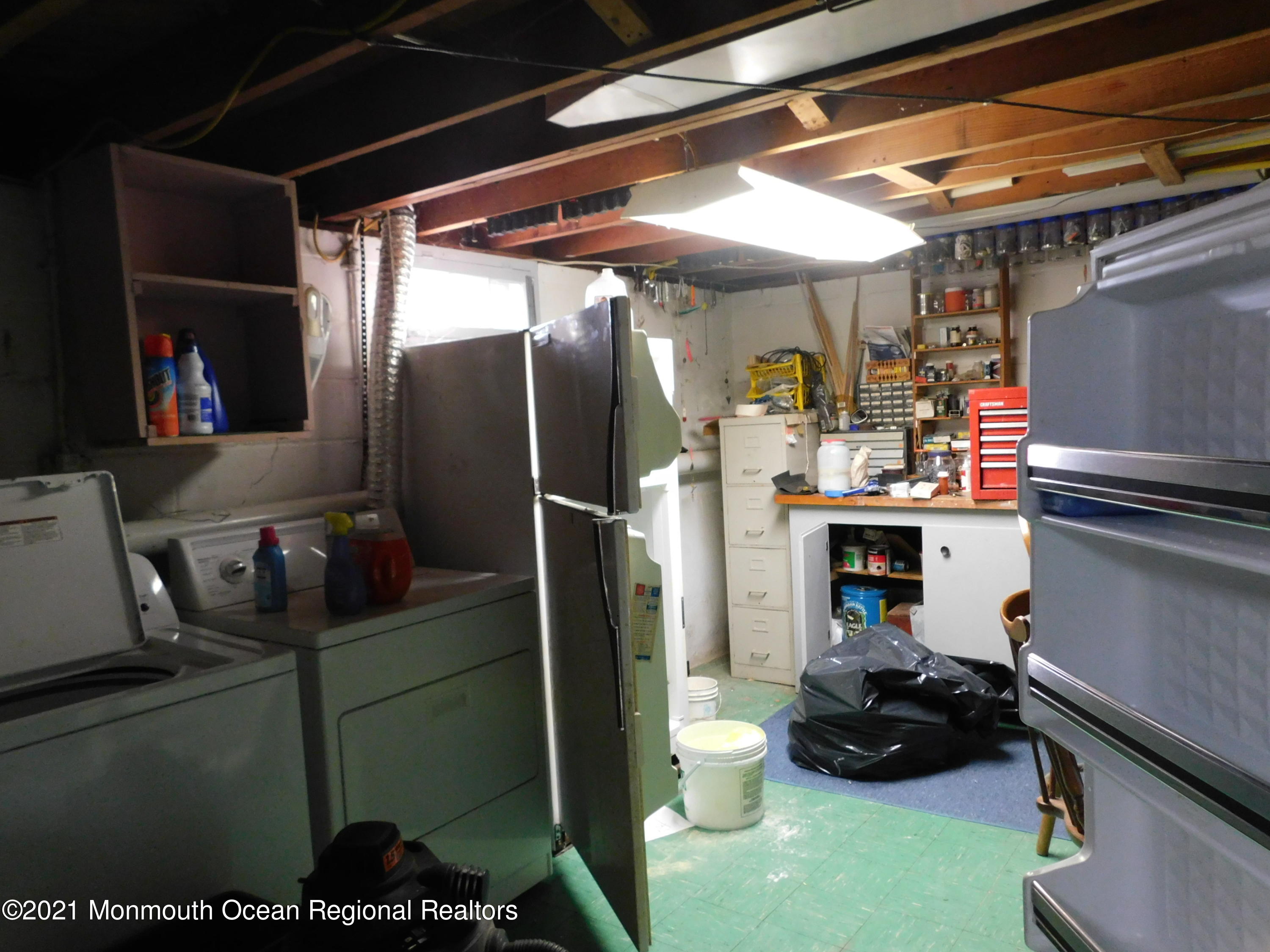 307 Eastham Road Point Pleasant, NJ 08742 - Photo 11 of 11 a storage room with washer and dryer