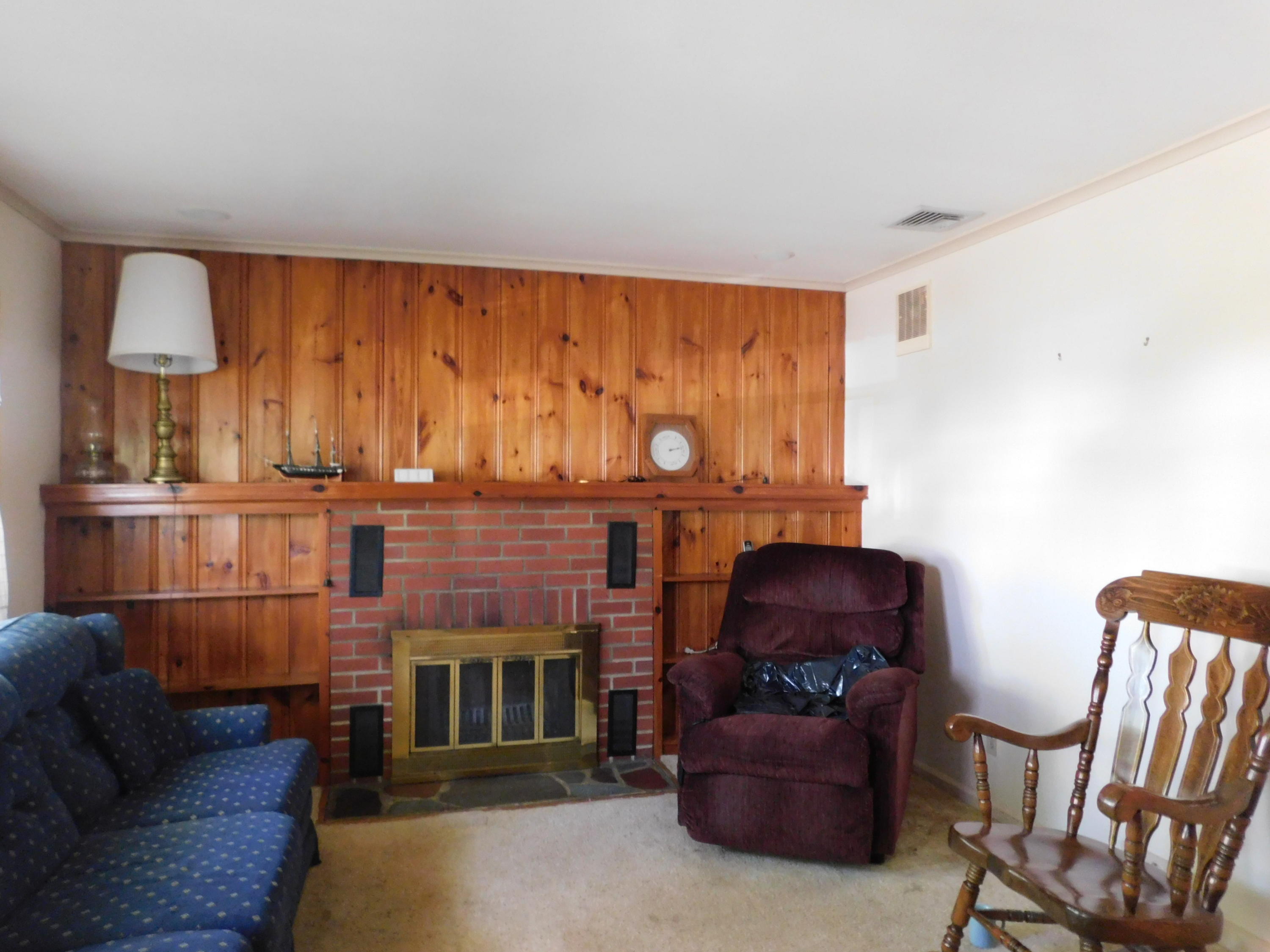 307 Eastham Road Point Pleasant, NJ 08742 - Photo 4 of 11 a living room with furniture and a fireplace
