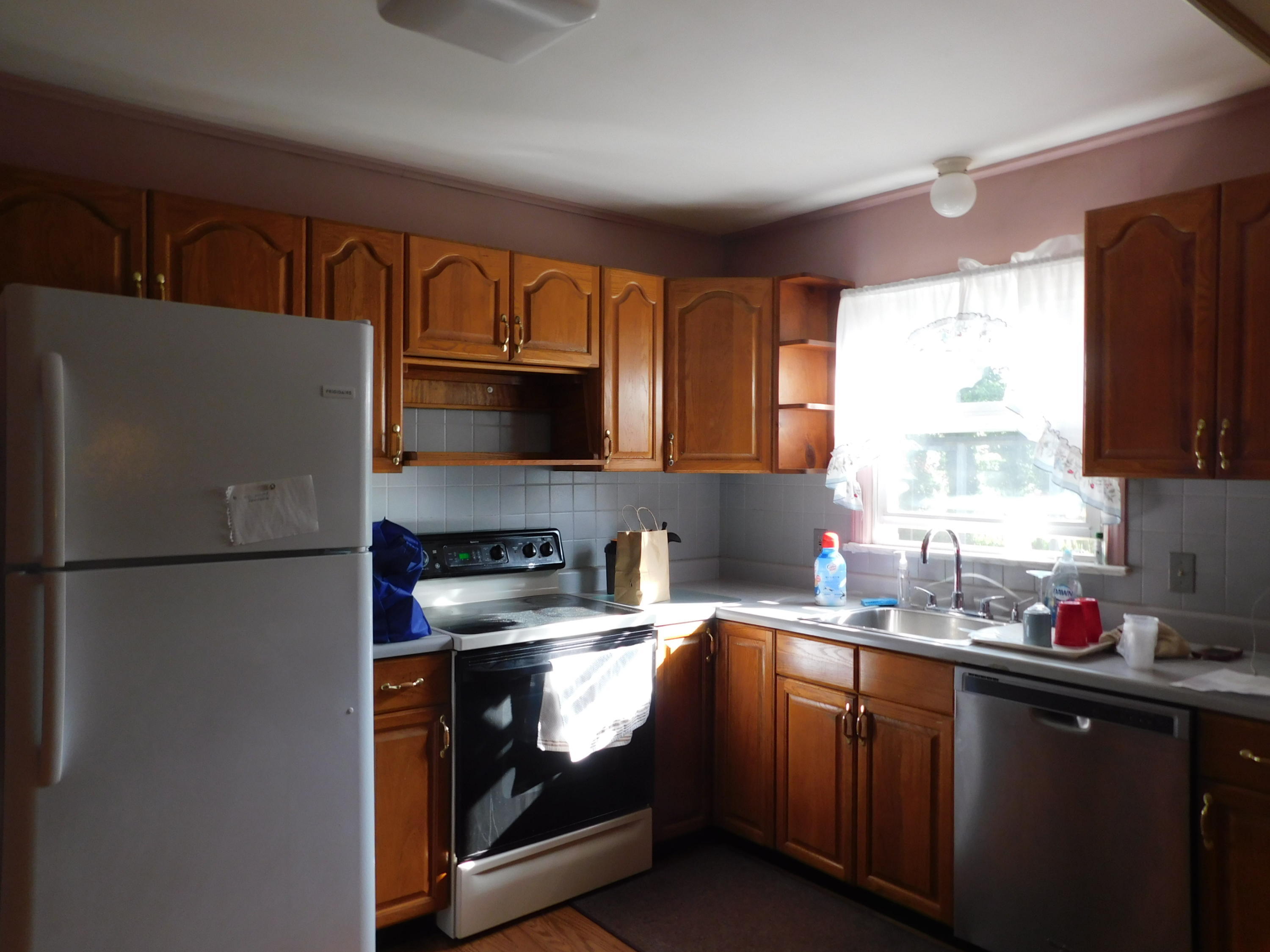 307 Eastham Road Point Pleasant, NJ 08742 - Photo 5 of 11 a kitchen with stainless steel appliances granite countertop a refrigerator sink and stove