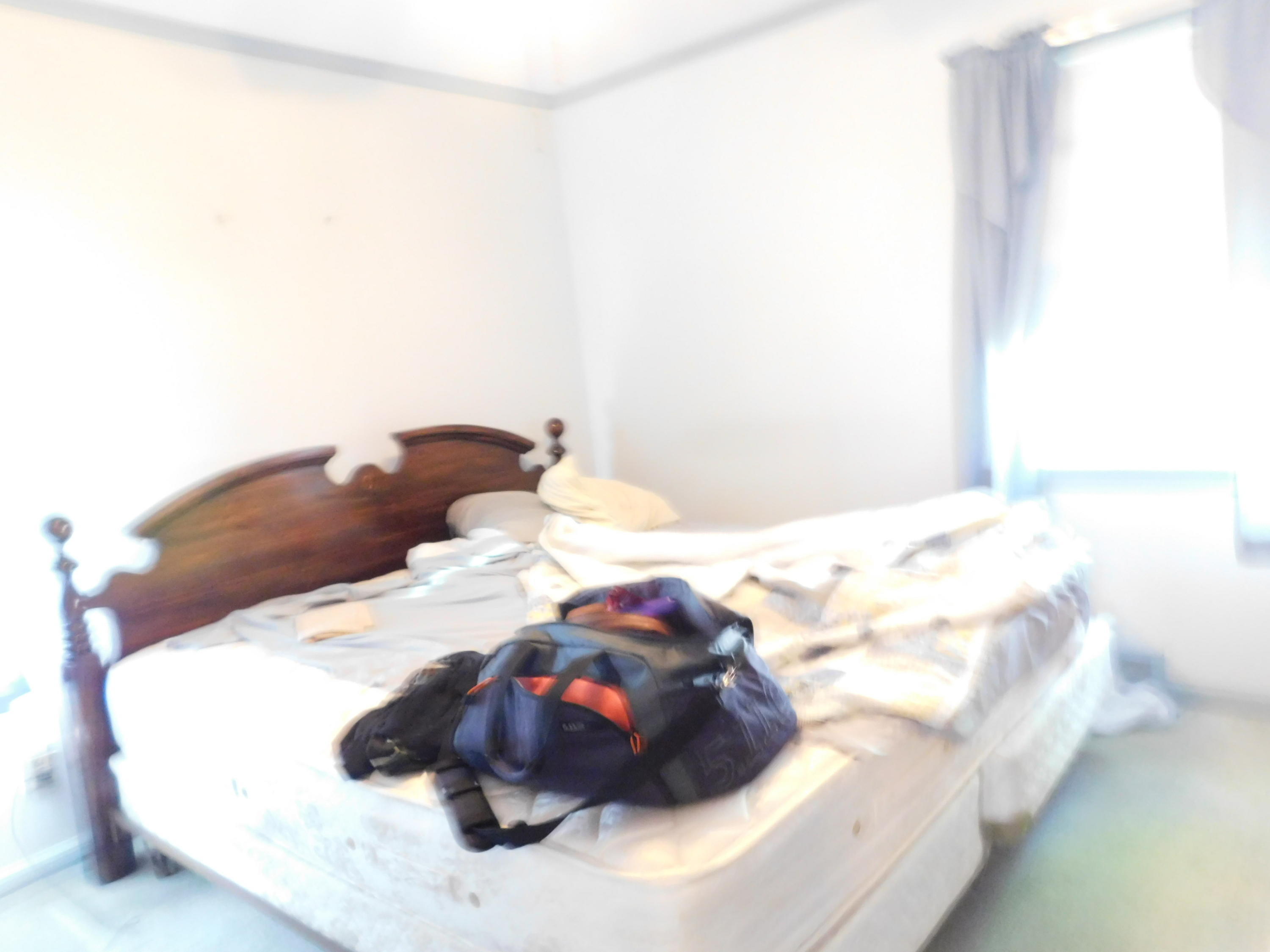 307 Eastham Road Point Pleasant, NJ 08742 - Photo 8 of 11 a white bath tub sitting in a bedroom and bed