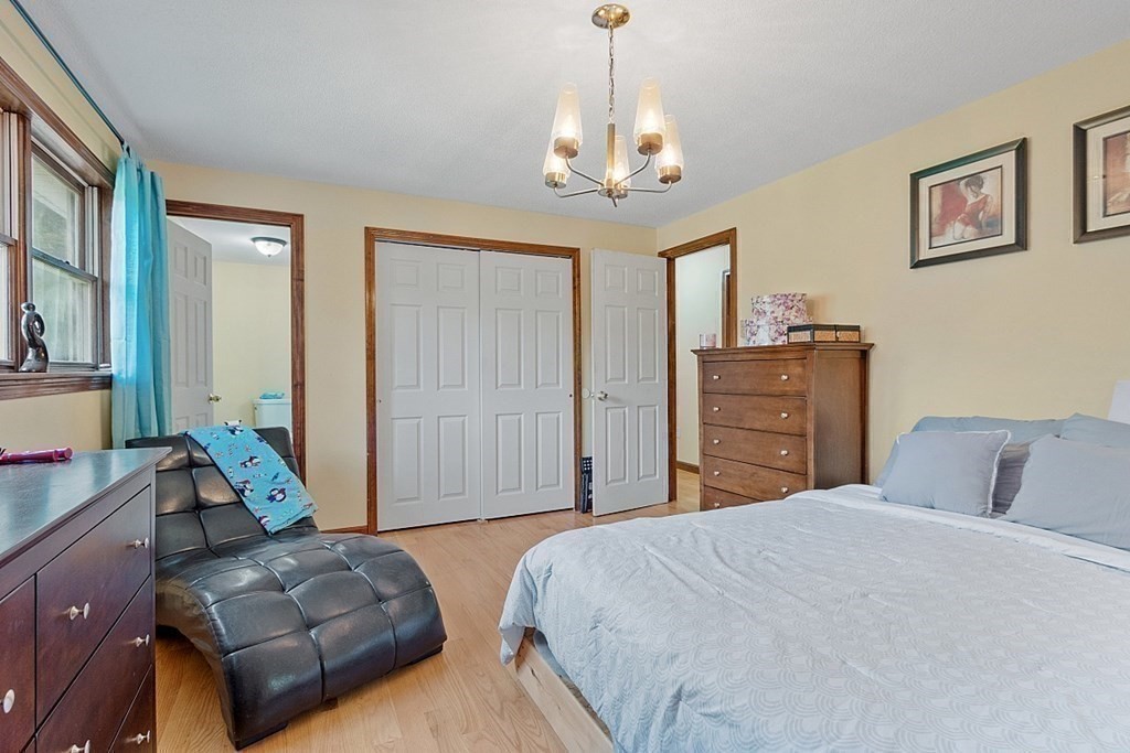 68 Gardner Road Winchendon, MA 01475 - Photo 16 of 41 a bedroom with a bed couches and wooden floor