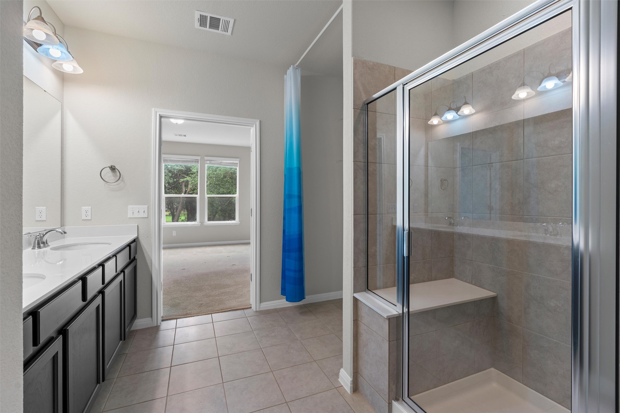 108 Calhoun Lane Georgetown, TX 78633 - Photo 20 of 32 a bathroom with a shower and a sink