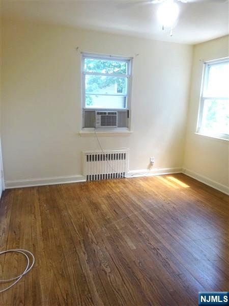 700 Kinderkamack Road River Edge, NJ 07661 - Photo 11 of 19 an empty room with wooden floor and windows
