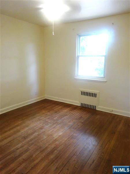 700 Kinderkamack Road River Edge, NJ 07661 - Photo 13 of 19 an empty room with wooden floor and windows