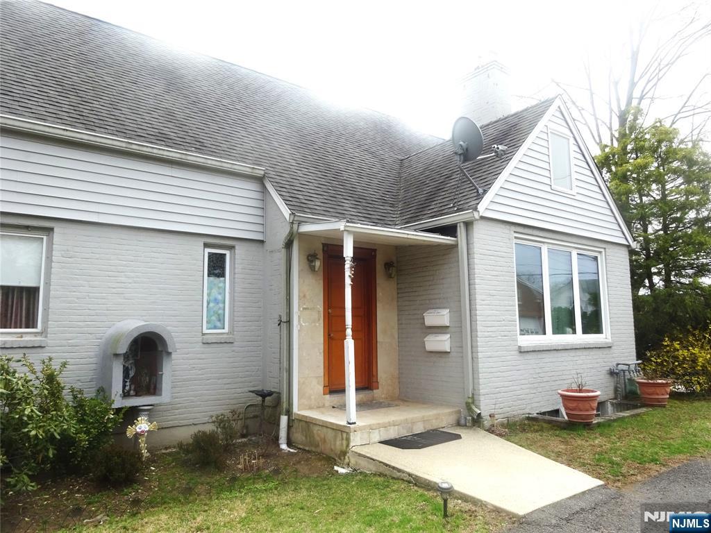 700 Kinderkamack Road River Edge, NJ 07661 - Photo 2 of 19 a front view of a house with garden