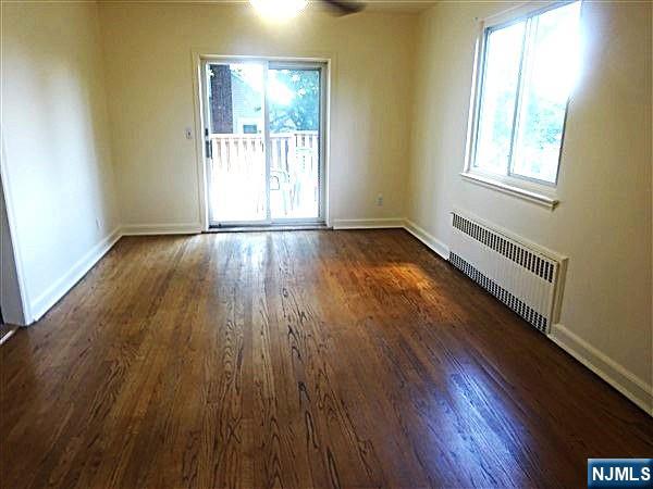 700 Kinderkamack Road River Edge, NJ 07661 - Photo 5 of 19 an empty room with wooden floor and windows