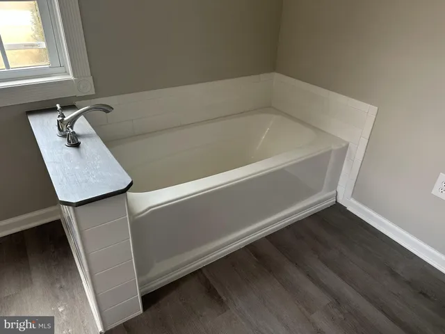 a white toilet sitting next to a bathroom sink