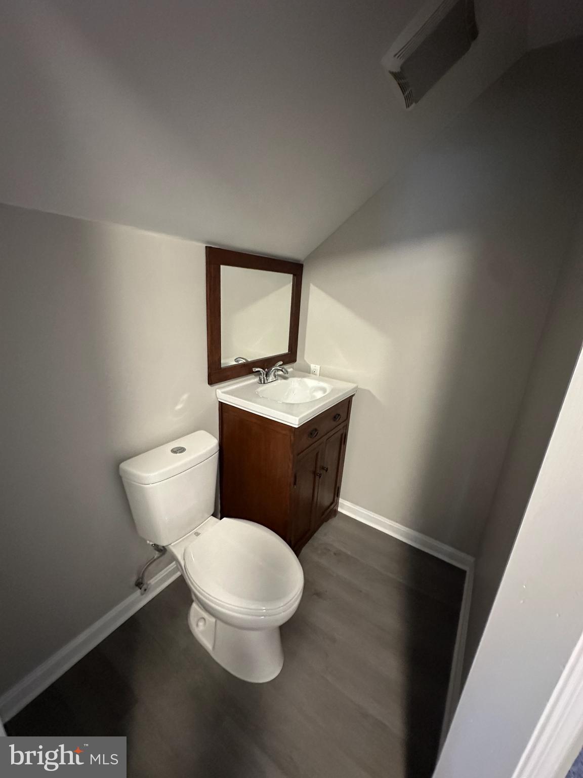 10516 Bird River Road Middle River, MD 21220 - Photo 21 of 23 a white toilet sitting next to a bathroom sink