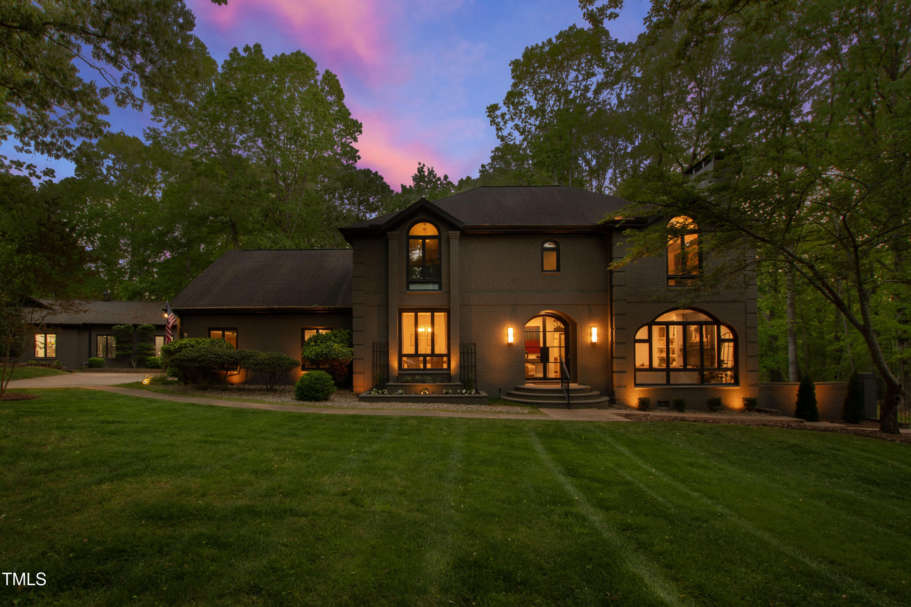 10805 The Olde Place Raleigh, NC 27614 - Photo 1 of 91 a front view of a house with a garden and trees