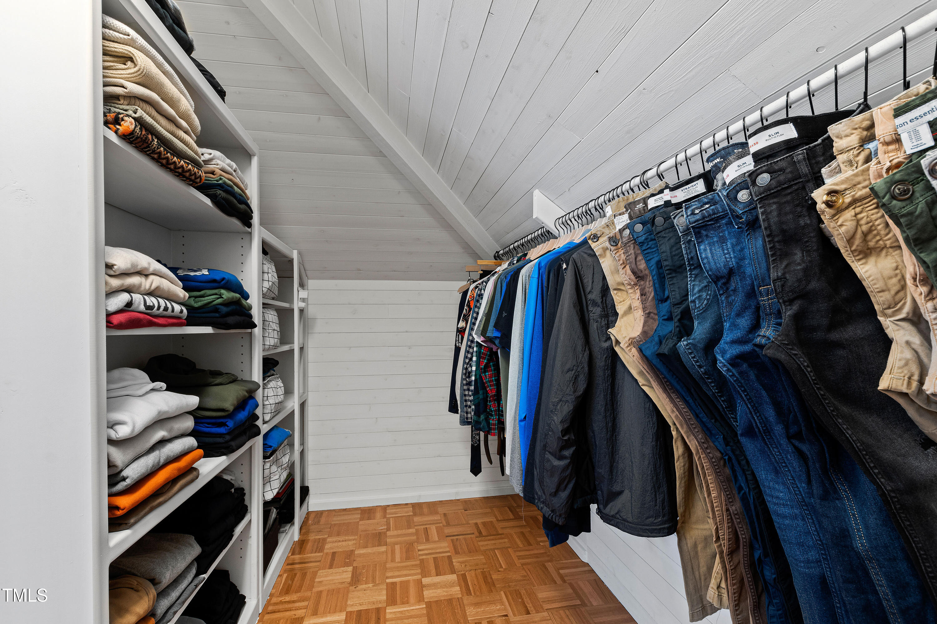 10805 The Olde Place Raleigh, NC 27614 - Photo 60 of 91 a view of walk in closet with clothes and shoes