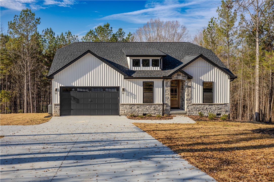 1409 Stonehurst Road Anderson, SC 29621 - Photo 3 of 37 This charming residence features board and batten siding with stone accents.