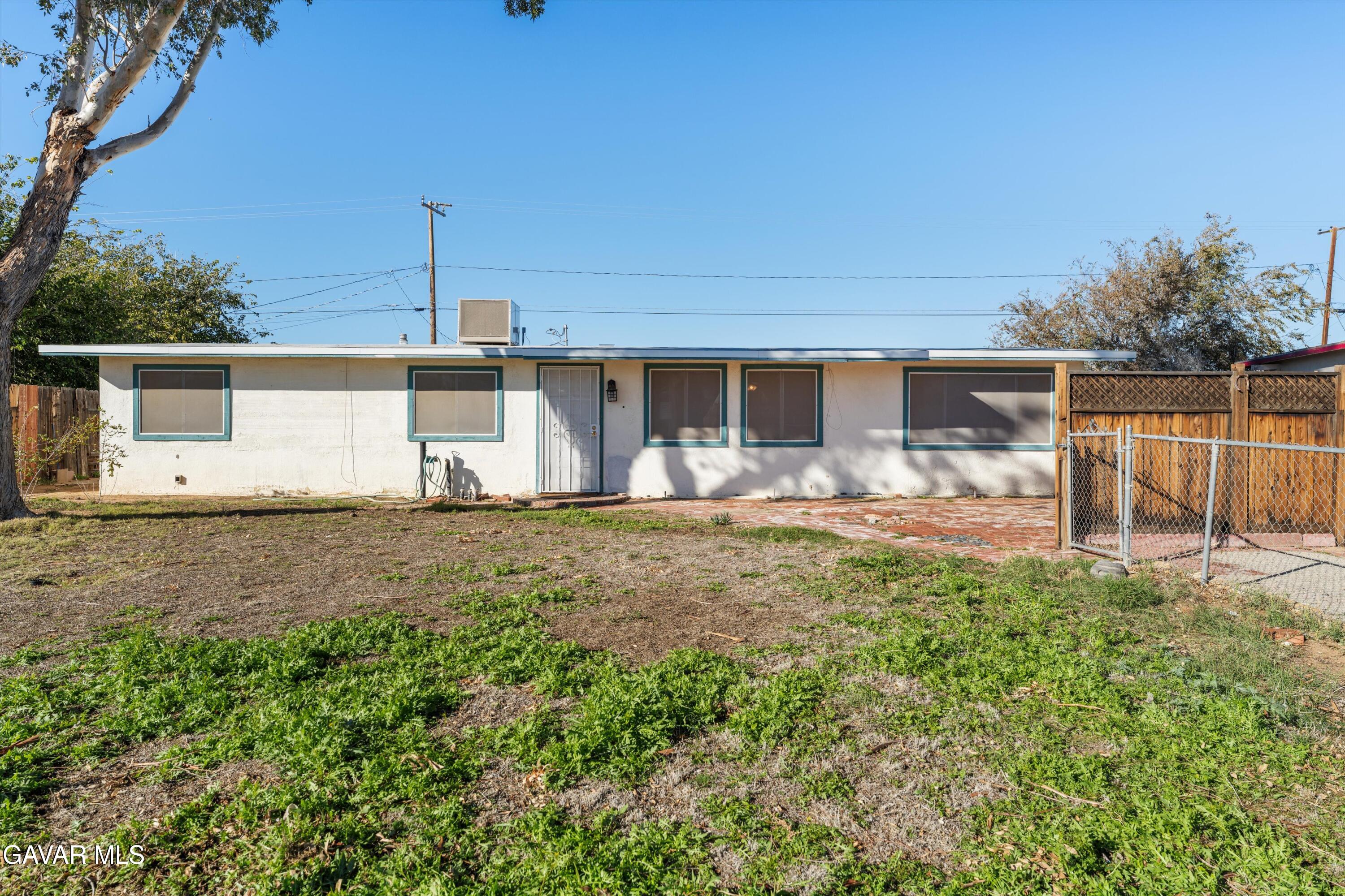 13445 Fran Street North Edwards, CA 93523 - Photo 1 of 27 a front view of a house with garden