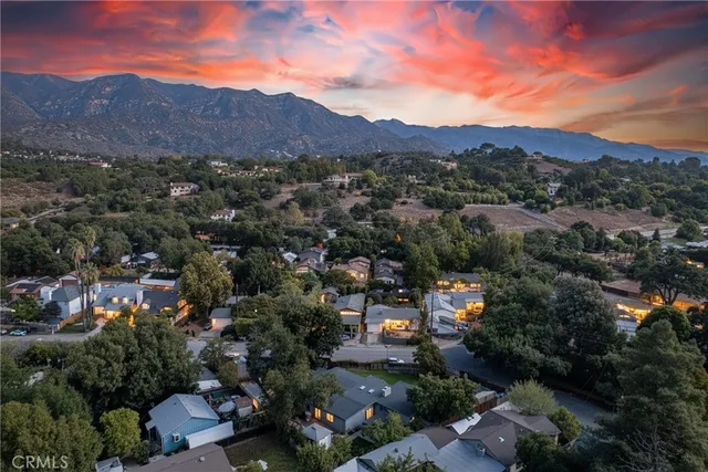 an aerial view of residential houses and outdoor space