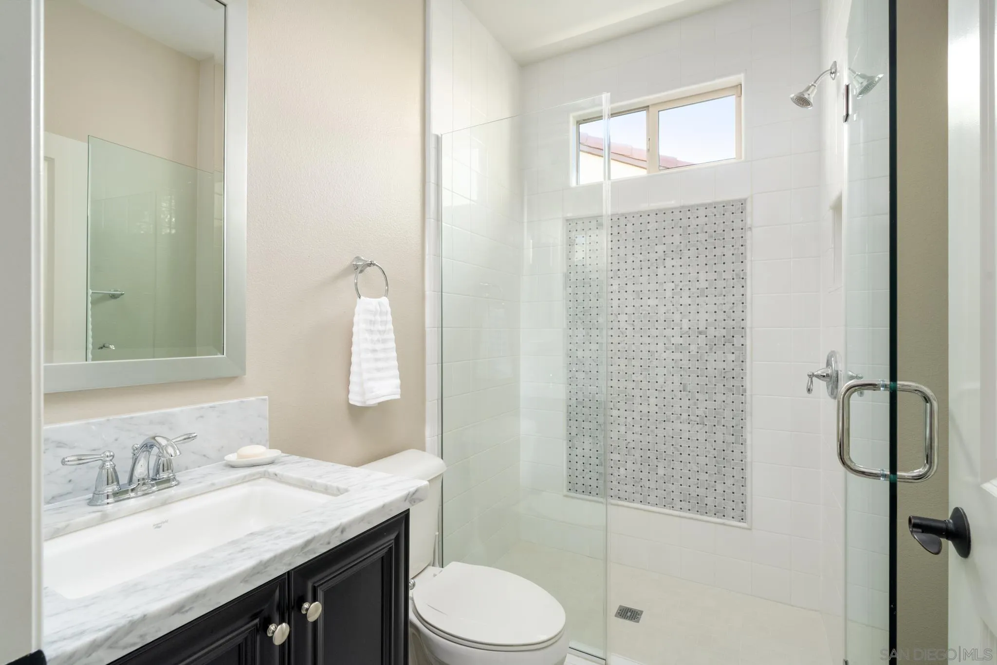 7964 Auberge Circle San Diego, CA 92127 - Photo 15 of 41 a bathroom with a granite countertop sink toilet a mirror and shower