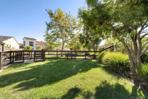 a view of a garden with houses