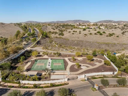 an aerial view of residential houses with outdoor space