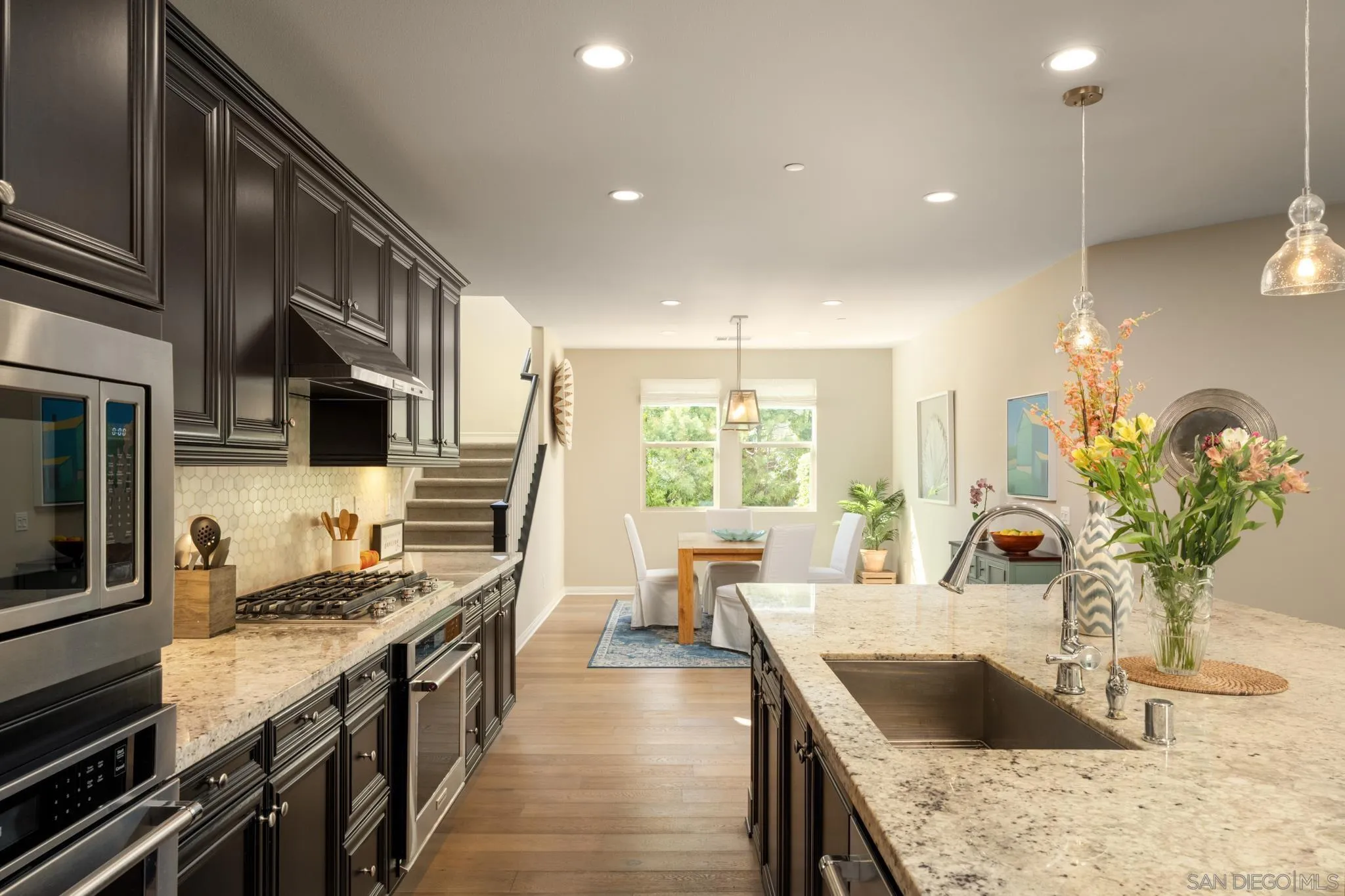 7964 Auberge Circle San Diego, CA 92127 - Photo 5 of 41 a kitchen with stainless steel appliances granite countertop a sink stove and refrigerator