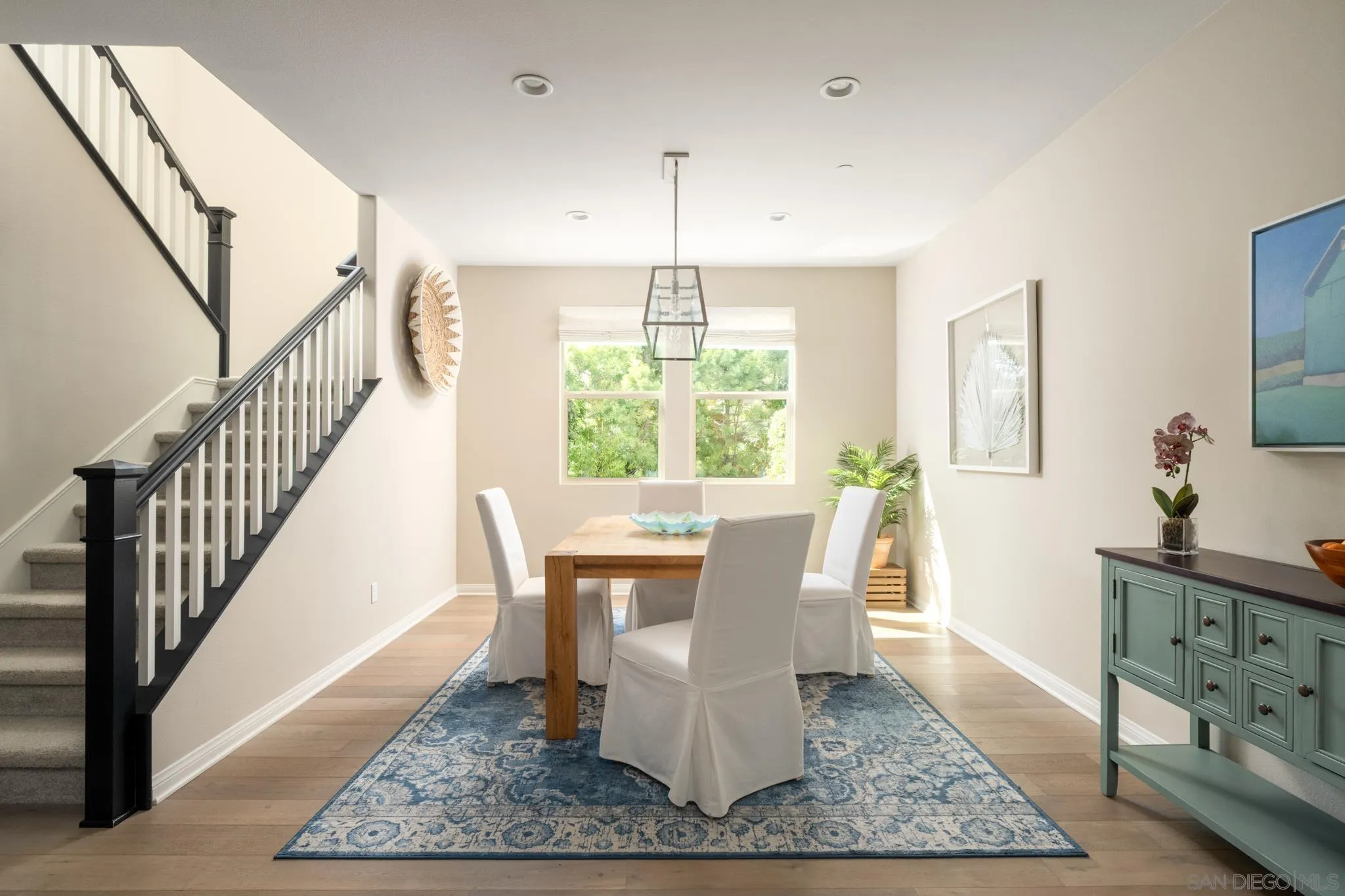 7964 Auberge Circle San Diego, CA 92127 - Photo 8 of 41 a dining room with wooden floor and a rug